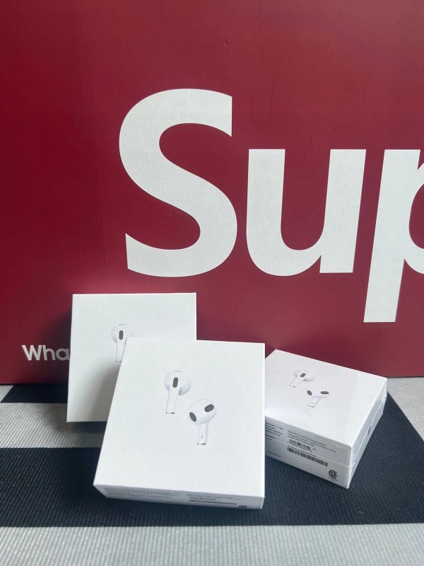 Apple red wireless earbuds in modern everyday style