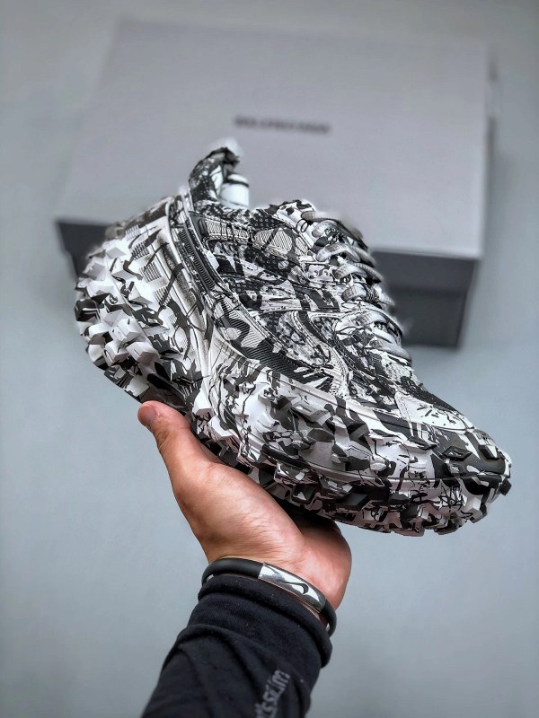 Balenciaga Defender low-top in gray nylon and mesh, with a tire-tread sole and hand-finished distressing
