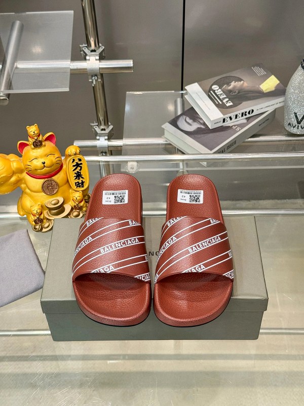 Balenciaga Orange Slides: Roomy Slip-On Fit With a PU Upper and Rubber Outsole