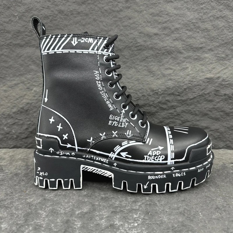 Balenciaga Strike mid-calf lace-up boot in matte calfskin with a lugged rubber outsole