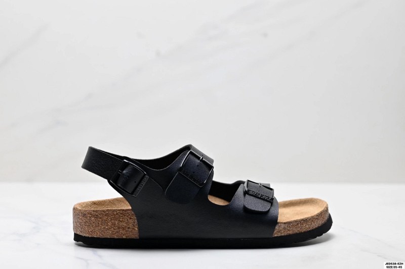 Birkenstock black suede slides with twin buckles and a sheepskin-lined footbed