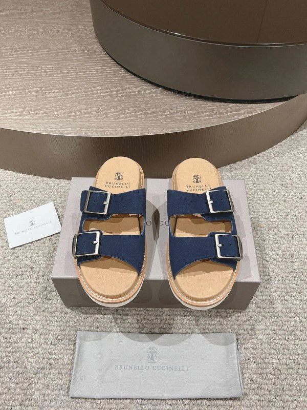 Brunello Cucinelli washed-suede slides with an adjustable antiqued buckle