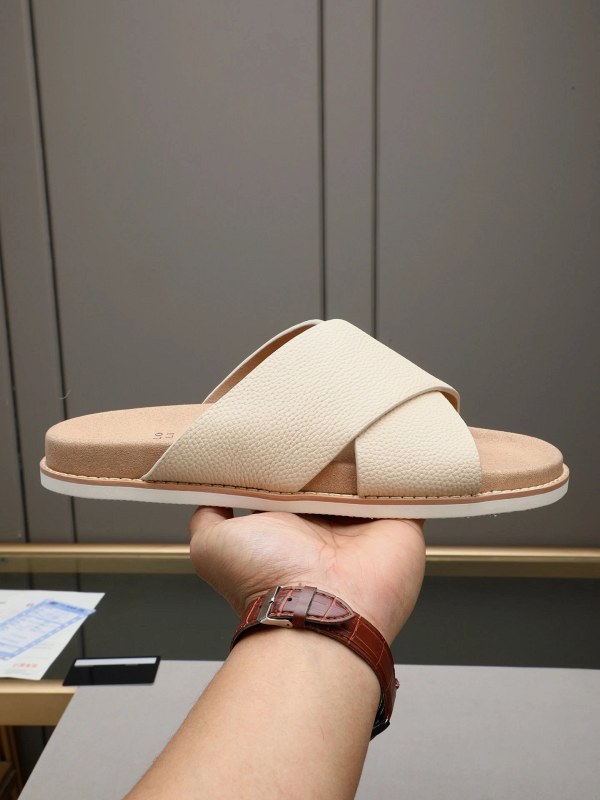 Brunello Cucinelli crossover-strap slides in Italian brushed leather with an adjustable buckle