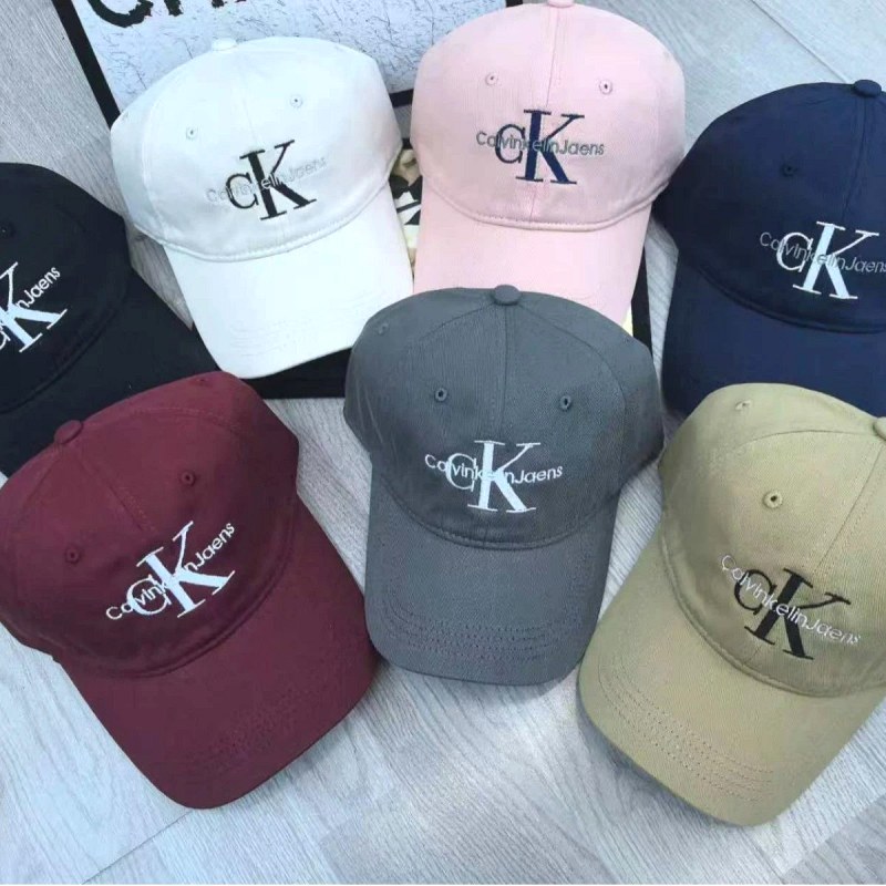 Calvin Klein Multicolor Baseball Cap Collection — Washed-Denim Caps With an Adjustable Back Buckle in 13 Colorways