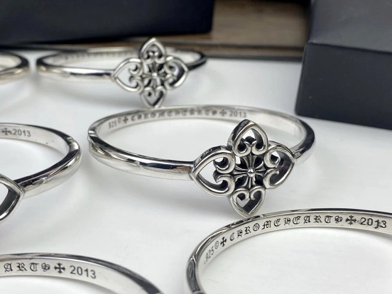 Chrome Hearts silver ring in modern everyday style, catalogued alongside a cross-petal bracelet description