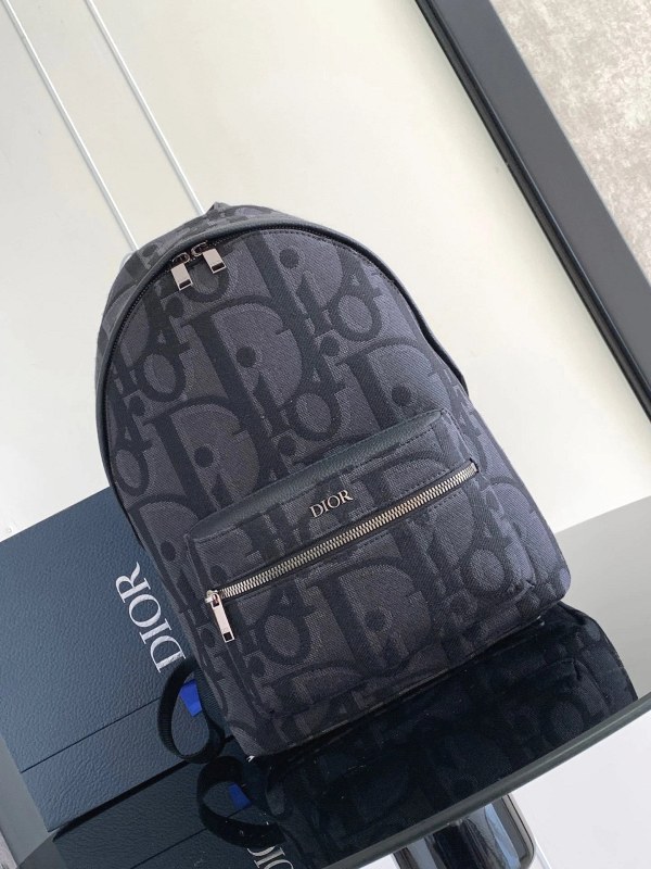 Black Dior Oblique-style backpack with embroidered lettering and air-cushion straps