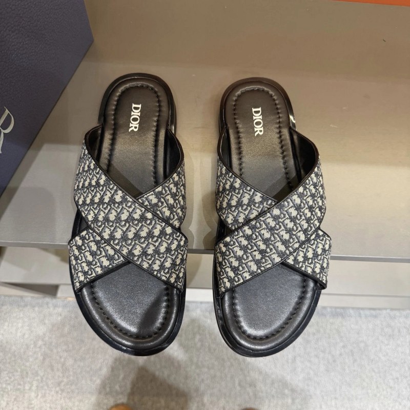 Dior Alias-style black crossover slides in grain calfskin with Oblique print and a brass Diamond emblem