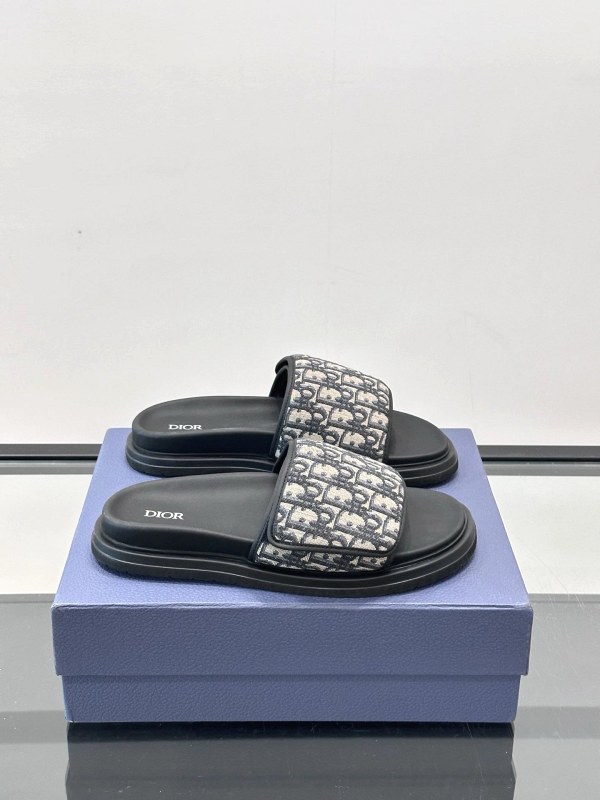 Dior black slide with an adjustable hook-and-loop strap and leather-lined footbed