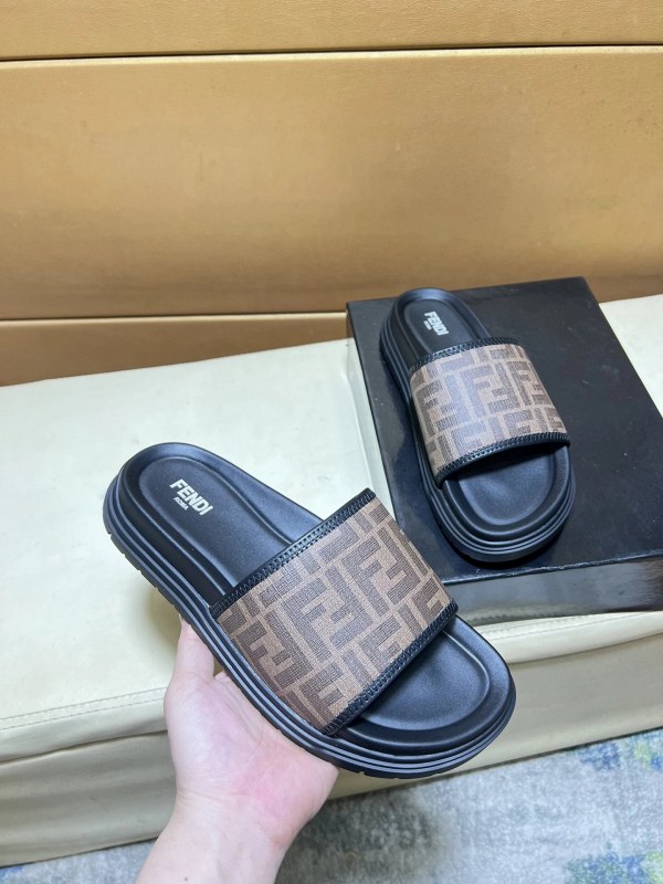 Fendi black slides with a leather logo-strap upper in a casual, easy-on silhouette