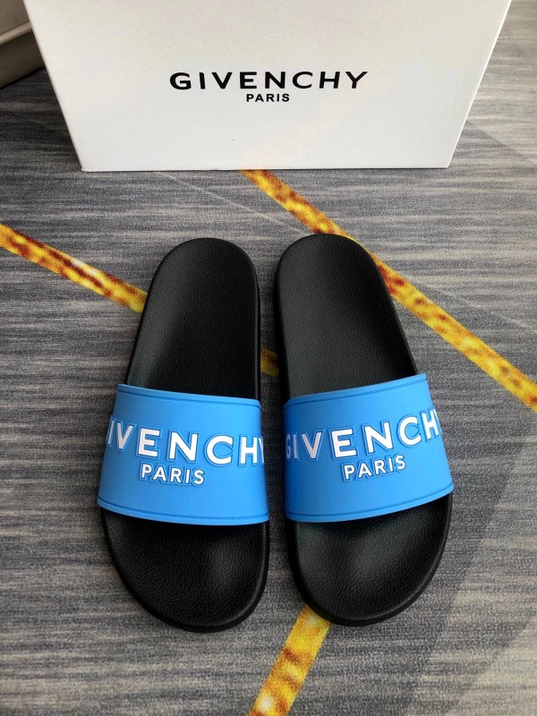 Givenchy black slides with an injected rubber upper and raised logo lettering, sized 35–45