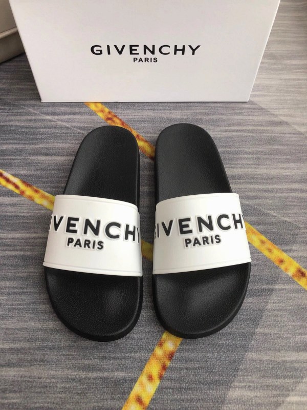 Givenchy black slides with embossed logo lettering and a 35–45 size run