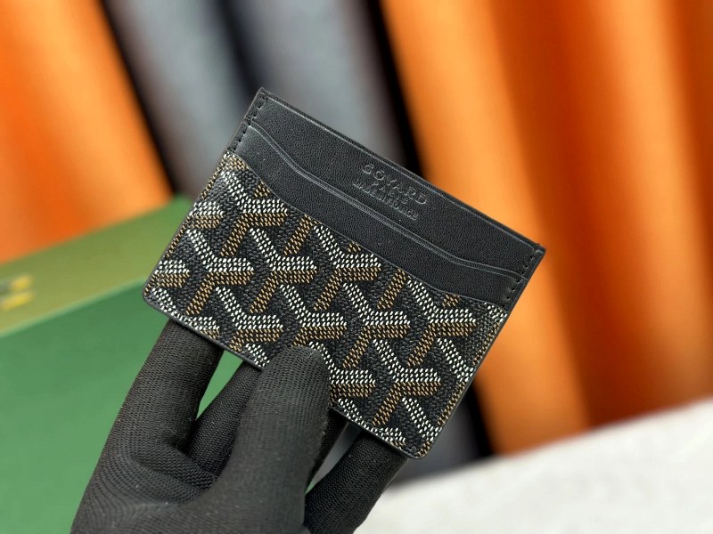 A compact Goyard card holder format at 10.5 × 7.5 cm