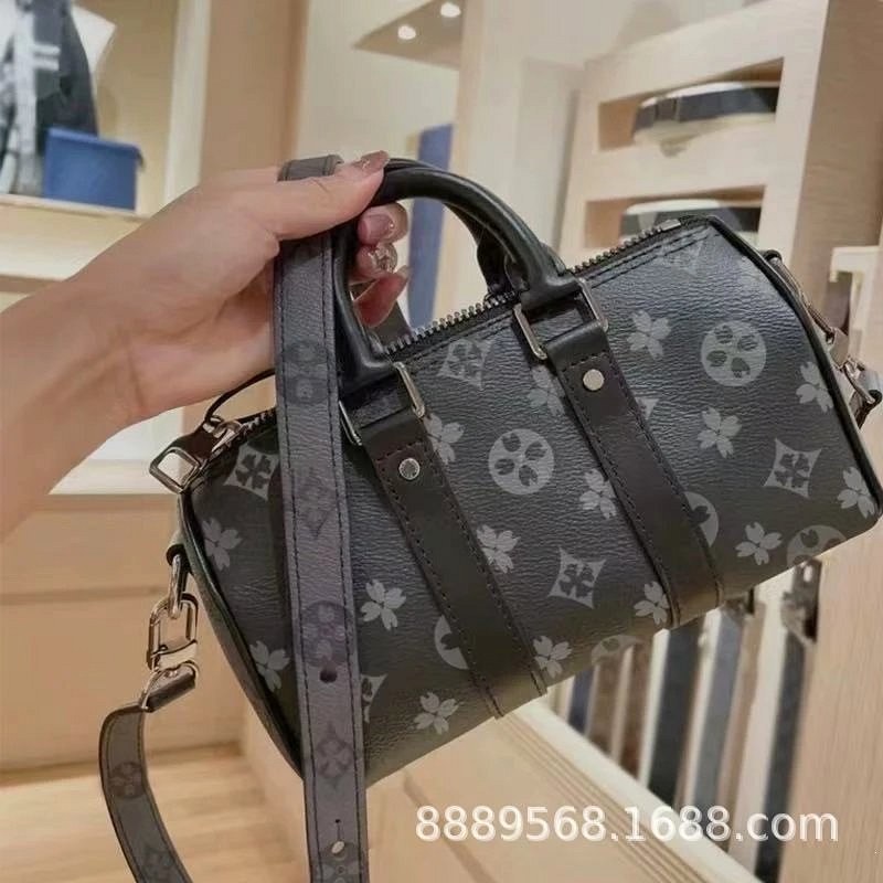 A Louis Vuitton grey leather everyday bag with a waterproof finish, canvas lining and 2024 fall styling