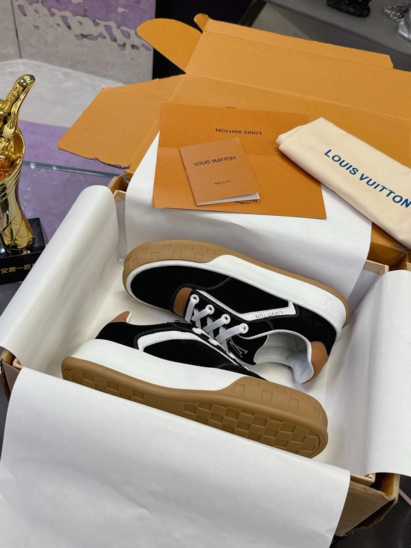 Louis Vuitton black and white sneakers in classic athletic style