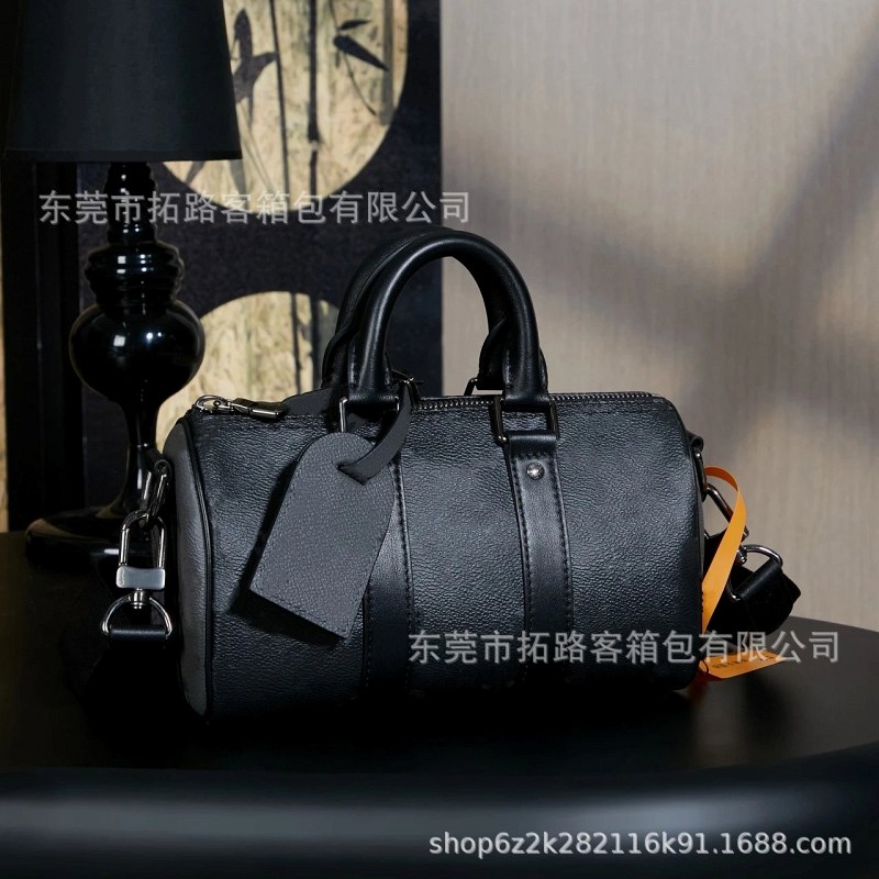 Louis Vuitton Black Barrel Bag in Cowhide, 25 Size, Listed With a 12-Inch Laptop Capacity