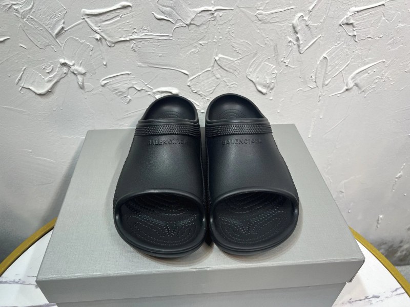 Louis Vuitton black slides in easygoing casual style