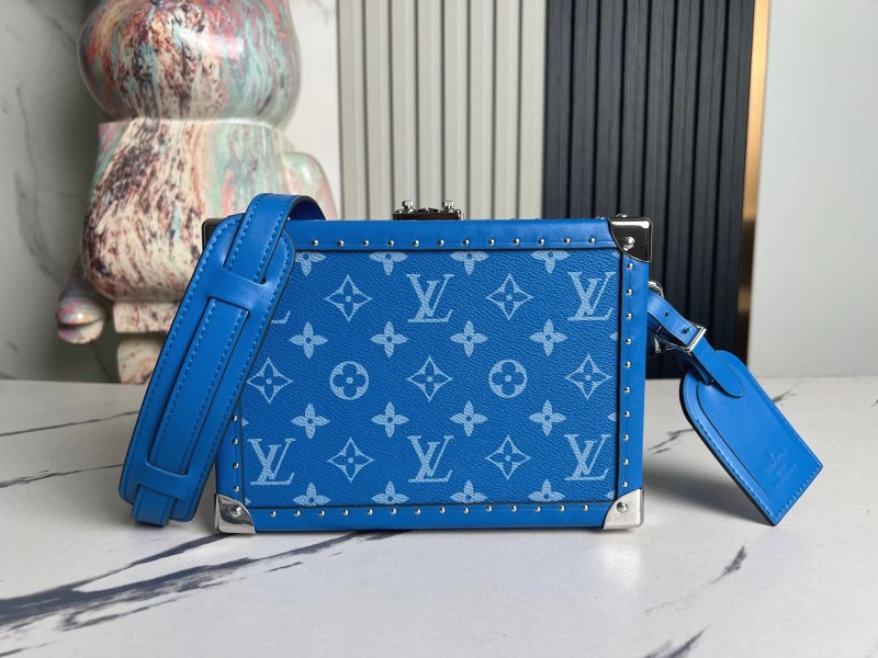 Louis Vuitton Clutch Box in Monogram Eclipse: a compact hard-box clutch with a leather shoulder strap