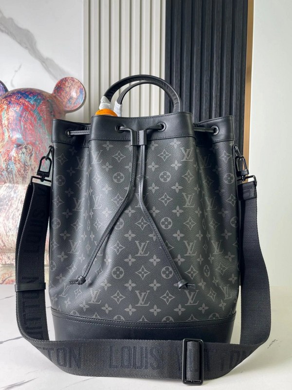 Louis Vuitton Maxi Noé Sling M46693: a round, zip-top Monogram Eclipse canvas sling
