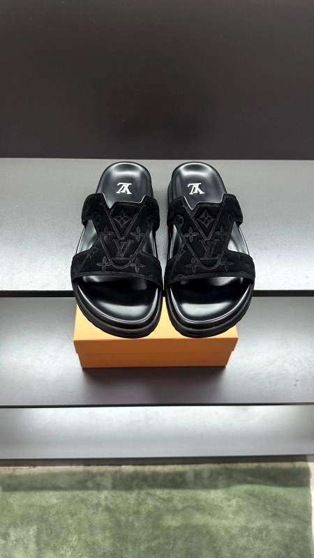 Louis Vuitton men's slide in a plain, easygoing silhouette, listed with a leather upper and molded sole