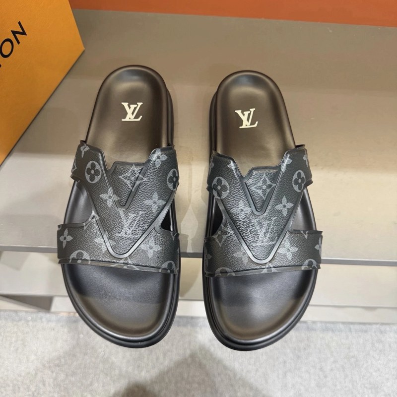 Louis Vuitton black slides with an Italian-sourced leather upper and cowhide insole