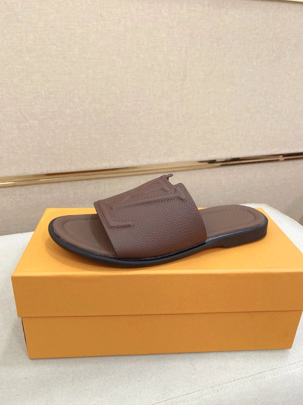 Louis Vuitton brown slides with a leather upper and molded sole, listed in EU 39–44