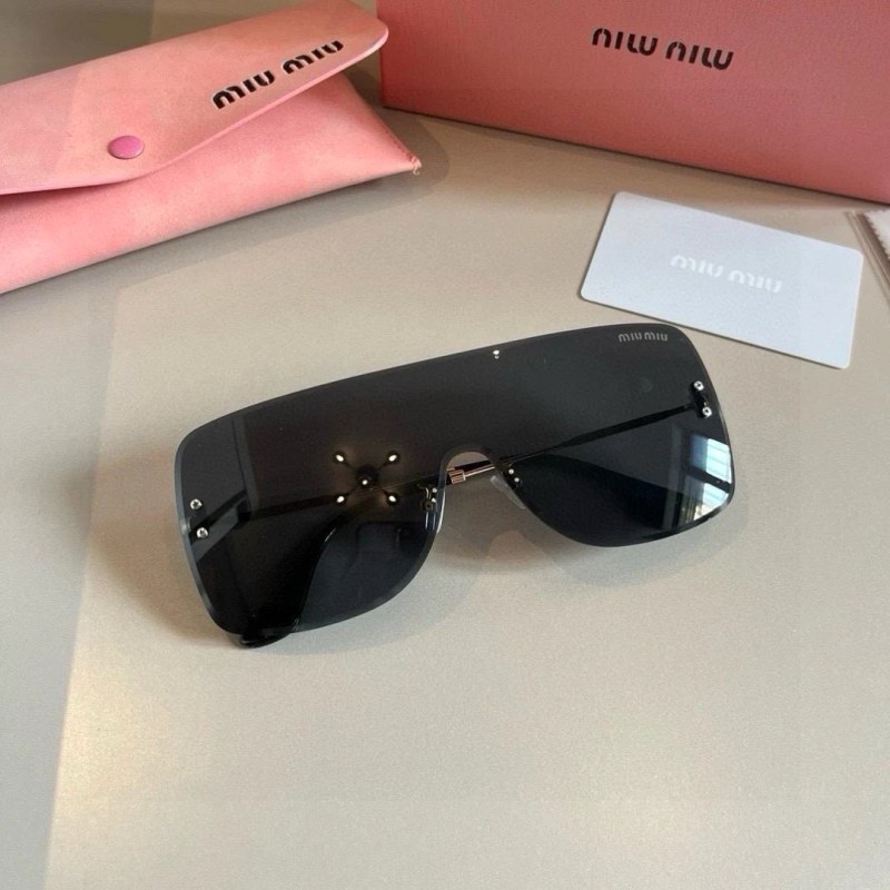 Miu Miu Black Rimless Sunglasses in a Modern, Face-Slimming Silhouette