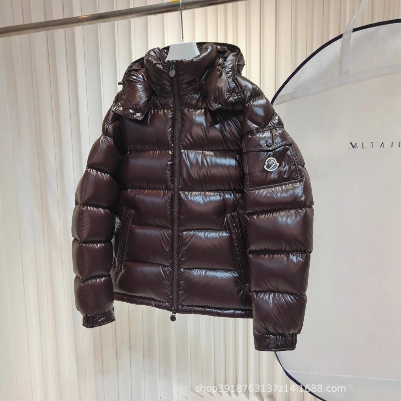 Moncler black puffer jacket in cold-weather street style