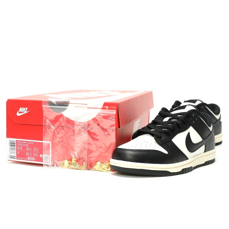 Nike black low-top sneaker in the Dunk Panda look, listed with a top-grain leather upper