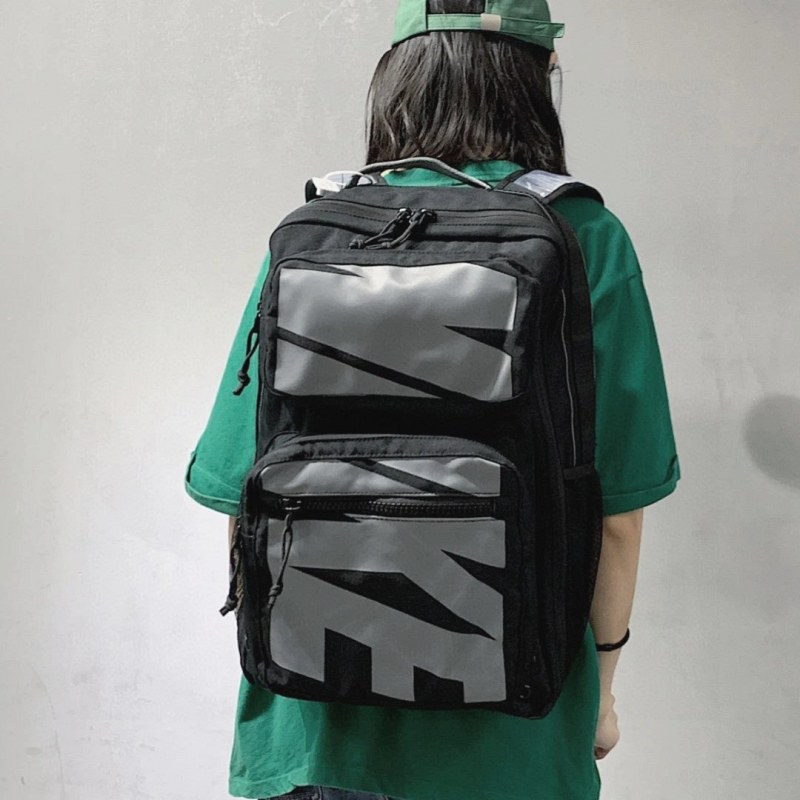 Nike nylon everyday bag with air-cushion straps and a 36–55L listed capacity