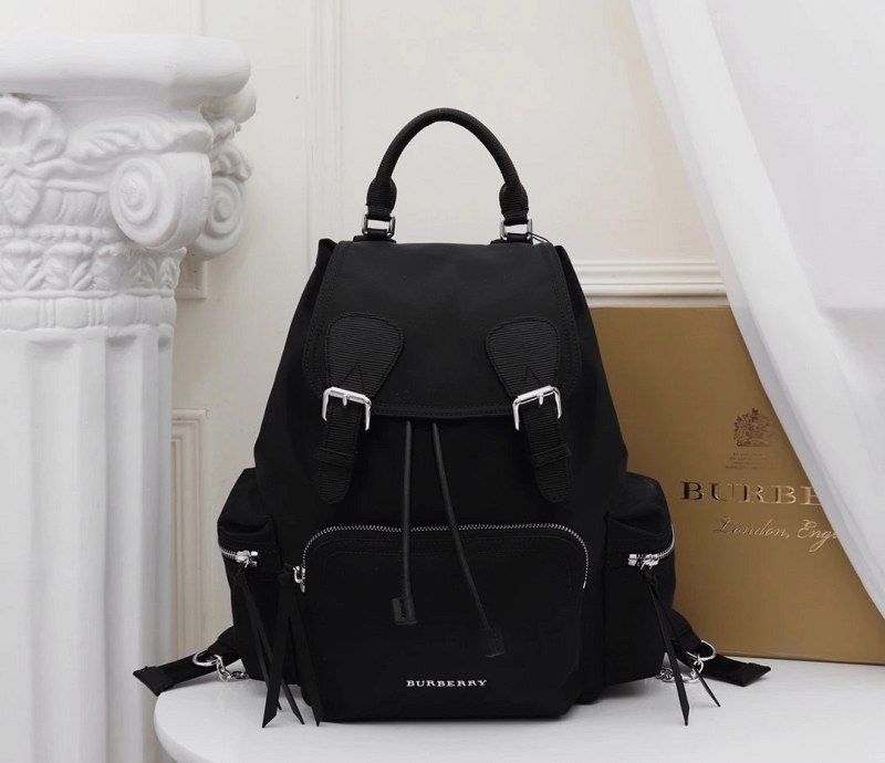 Prada Black Nylon 'The Rucksack' Backpack, Medium: Rain-Resistant Shell, Padded Straps With Chain Detail (22 × 14 × 33 cm)