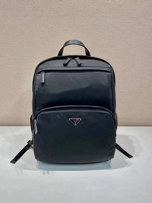 Prada nylon backpack, 2VZ104: Saffiano leather top handle and a four-pocket zip layout