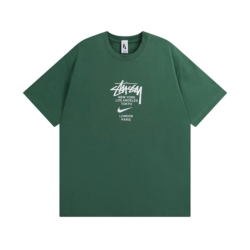 Stussy Angel Graphic Green Tee in 250–300 g Cotton, Loose Crew-Neck Cut