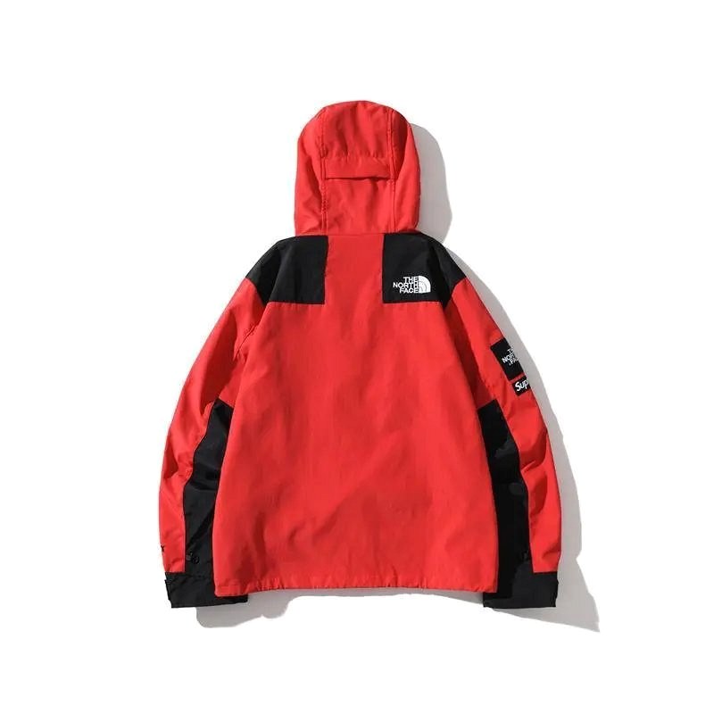 The North Face red shell jacket in outdoor technical style