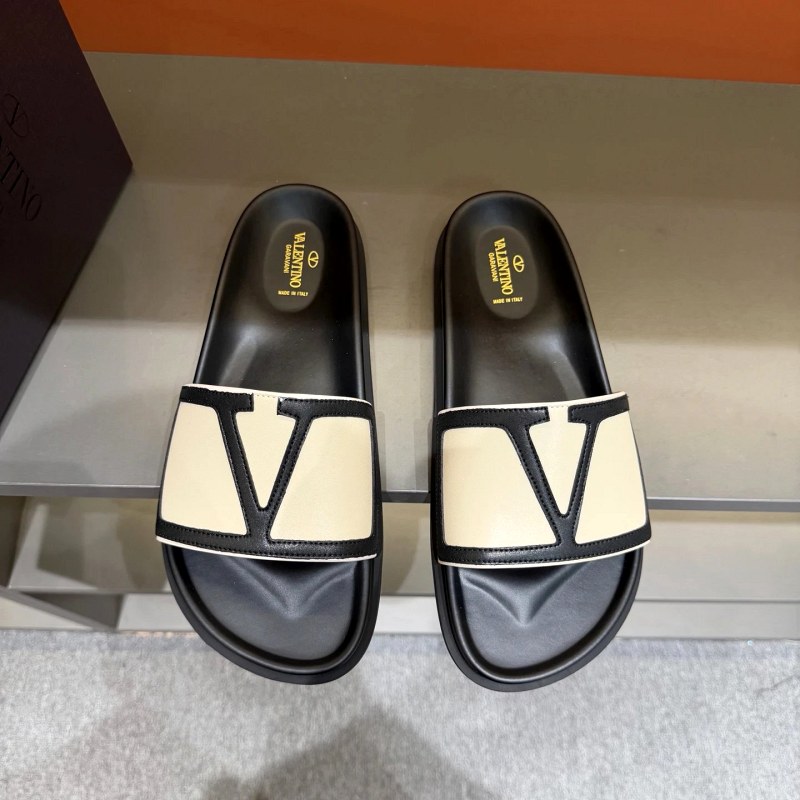 Valentino Black Metal-Logo Flat Slides with a Leather Upper and Rubber Sole