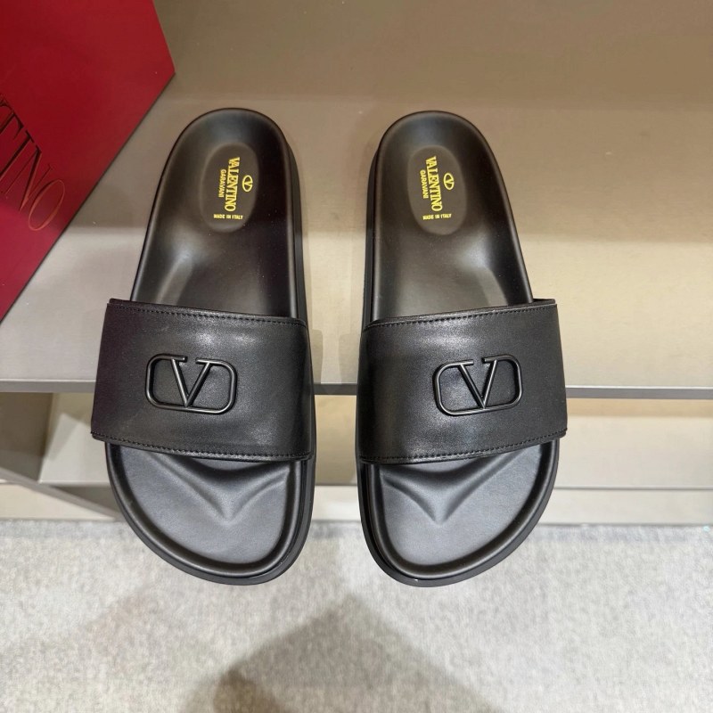 Valentino black metal-logo slide in flat casual style, listed in sizes 39–45