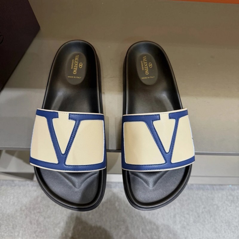 Valentino black metal-logo flat slides in EU sizes with calf leather upper and rubber outsole