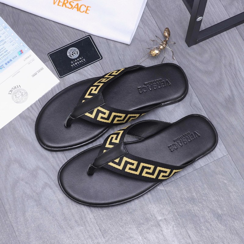 Versace black slides with a woven-webbing and cowhide upper on a rubber outsole