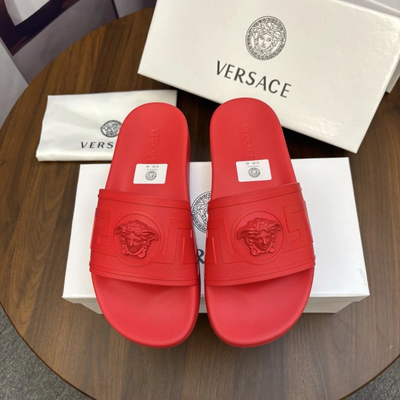 Versace red slides in a casual TPU build, with reports of a slightly generous fit