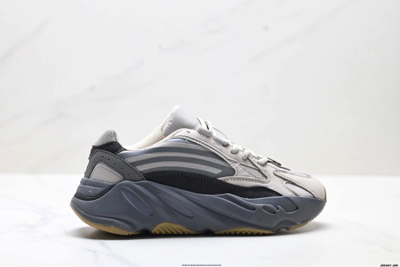 Yeezy Boost 700 in black — Boost-cushioned retro runner with a narrow, snug fit